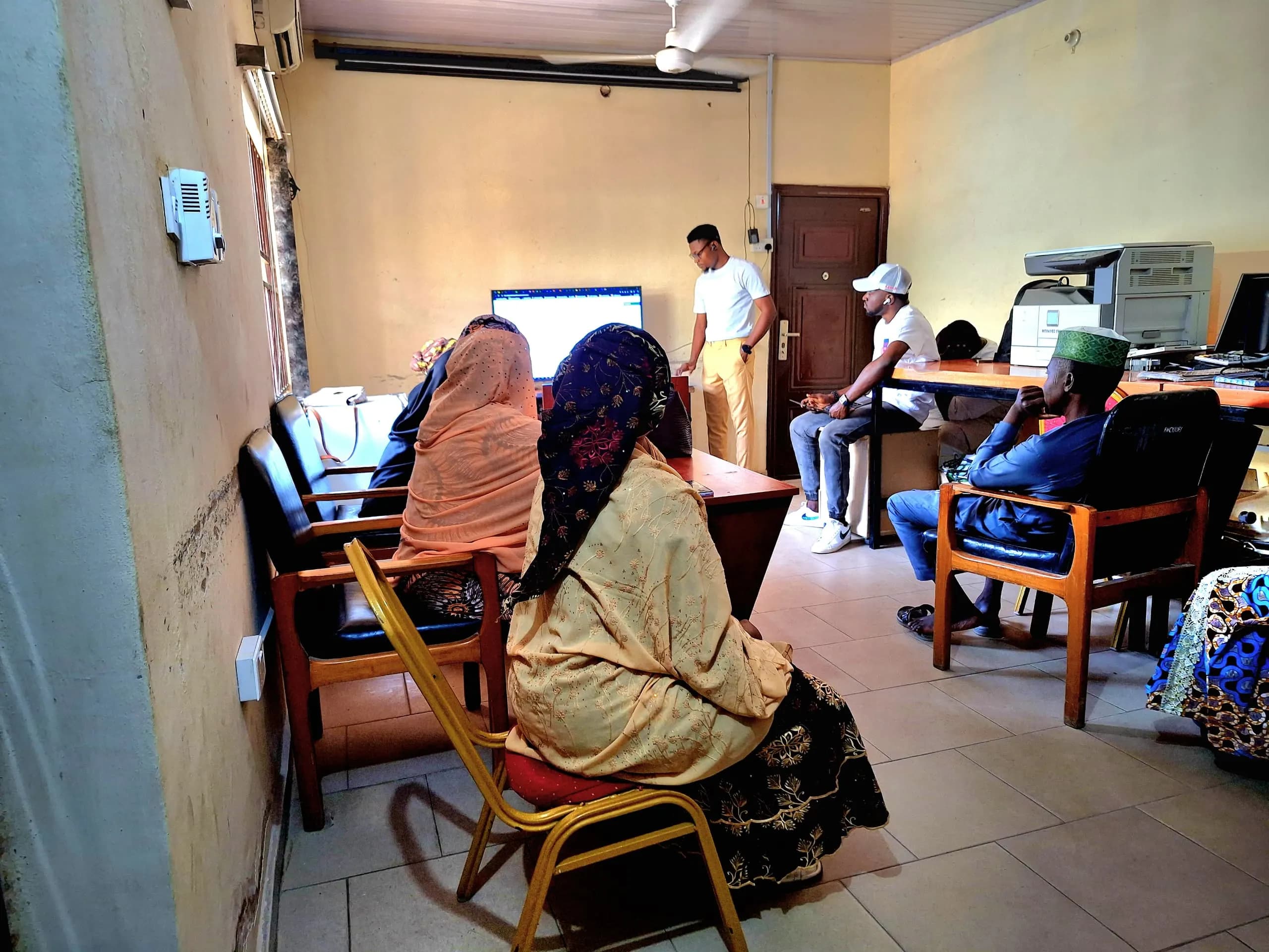 Participants watching a training demo